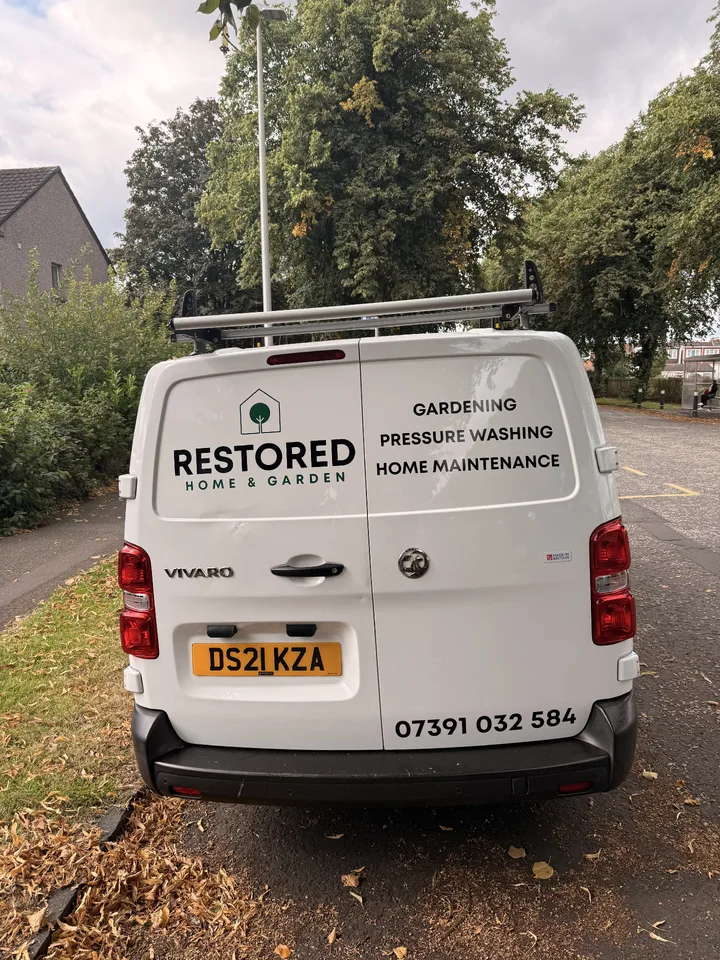 Rear doors of a white Vauxhall Vivaro with home and garden logo and service lettering